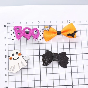Set of 4 Halloween hair clips featuring glitter bats, ghosts and pink Boo bows