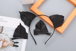 Detail of black sequin bat ears headband and clips set for Halloween party decor