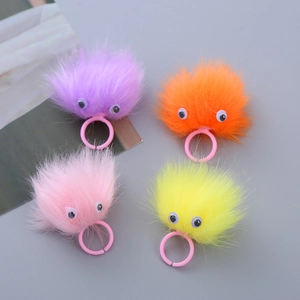 Set of 4 colorful plush monster rings for kids with fuzzy fur and cute large eyes