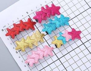Detailed scale view of 6cm colorful glitter star hair clips with metal duckbill clips