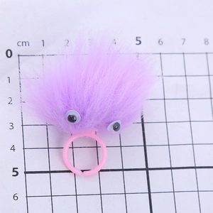 Cute purple plush monster ring with movable eyes and adjustable pink plastic band