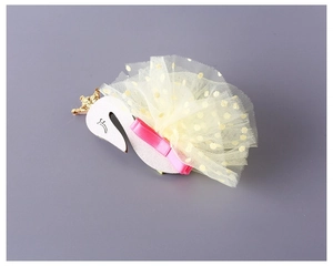 Detail of children swan hair hoop with golden crown and pink ribbon on mesh