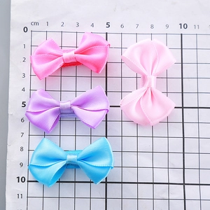 Set of four handmade polyester ribbon bow hair clips in pink, rose, purple, and sky blue