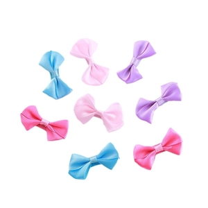 Eight colorful satin bow hair clips for kids in various pastel shades on white background