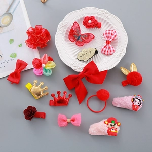 Children's New Year hair clip set with festive red bows and cute cartoon characters