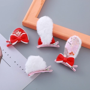 Lot de 4 barrettes à cheveux pelucheuses de Nouvel An avec nœuds rouges et pompons