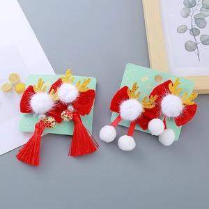 Barrettes à nœuds en velours rouge avec bois de renne dorés et pompons festifs