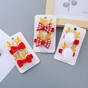 Barrettes bois de renne de Noël avec nœuds rouges festifs et pompons blancs pour petites filles