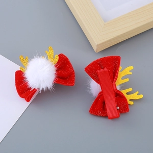 Paire de barrettes de Noël à nœuds rouges avec bois de renne dorés et pompons blancs