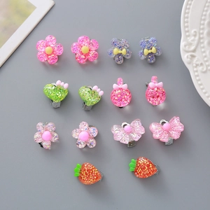 Cute resin ear clips set for girls featuring glittery crown flower and heart shapes