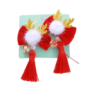Barrettes noeuds rouges avec bois de cerf dorés et longs glands pour filles