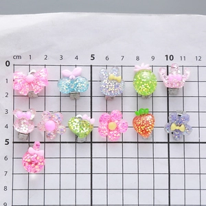 Sparkly 11-piece resin hair clip set with glitter bow, crown and flower for girls