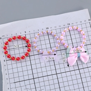Kids elastic beaded bracelet set with purple bows and gold accents for girls