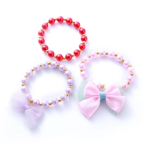 Kids beaded bracelet set with colorful pearls, gold beads and cute fabric bows