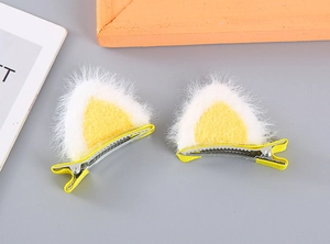 Detail of plush yellow cat ear hair clips for girls with non-slip metal alligator grips