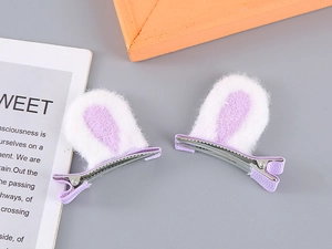 Detail of plush cat ear hair clips with light purple faux fur and metal alligator base