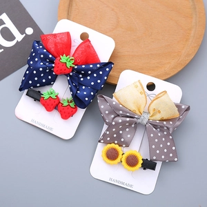 Cute girls resin bow hair clips set with strawberry and sunflower patterns on display card