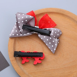 Cute girl's hair clip set with grey polka dot bow and red cherry resin design