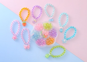 Detailed set of 8 colorful beaded bracelets for girls with cute resin pendants and storage box