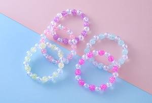 Detailed view of colorful iridescent crackle bead elastic bracelets in six pastel shades