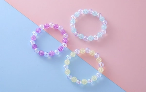 Close-up of sweet beaded bracelets set featuring colorful crackle texture acrylic beads