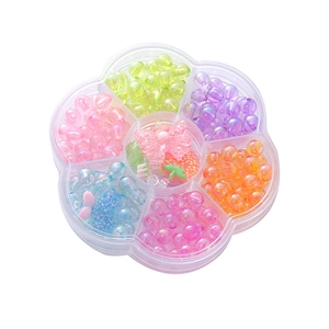 Kids DIY jewelry kit with colorful resin beads and strawberry charms in flower box