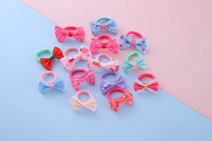Detailed view of colorful handmade bow hair ties with various patterns and high elastic bands
