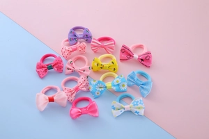 Detailed view of colorful grosgrain ribbon bow hair ties for girls in multiple patterns