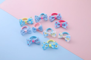 Set of 10 colorful children elastic hair ties with printed floral bow decorations