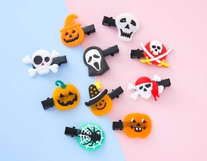 Close-up of PVC Halloween hair clips featuring ghost pumpkin and skull designs