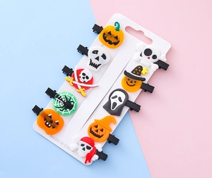 Detail of 10-piece Halloween PVC hair clips featuring ghosts, pumpkins and skulls