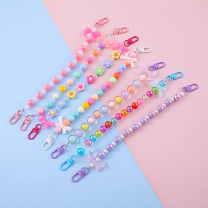 Colorful beaded keychain with floral and bow charms and secure spring lobster clasps