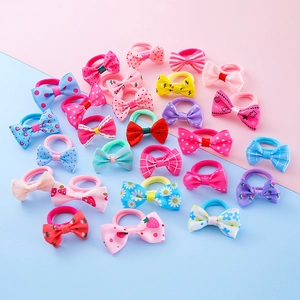 Set of colorful handmade bow hair ties with floral and polka dot patterns for girls