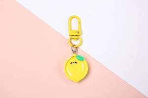 Cute cartoon lemon keychain featuring a yellow resin pendant with a matching metal hook