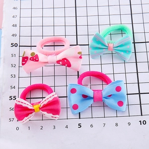 Set of four handmade ribbon bow hair ties in pink, blue and red for girls and students