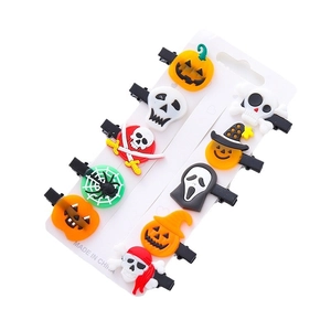 10-piece Halloween hair clip set featuring pumpkin, skull, and ghost PVC accessories