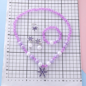 Children's jewelry set with snowflake pendant, beaded necklace, bracelet and ring in blue purple