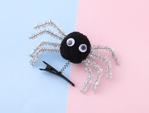 Detail of Halloween spider hair clip with spring legs and plush body on dual-tone background