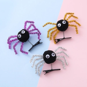 Three spooky Halloween spider hair clips with springs in purple, gold and silver glitter