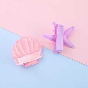 Cute pink shell and purple starfish hair clips with ribbed ribbon and metal duckbill clip