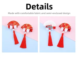 Detailed view of Chinese New Year red fan hair clips with tassels and pearl accents