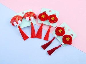 Detailed set of Chinese New Year hair clips with red lanterns, tassels and Fu character