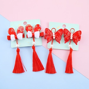 Traditional red Chinese New Year hair clips with tassels and rabbit ears for girls