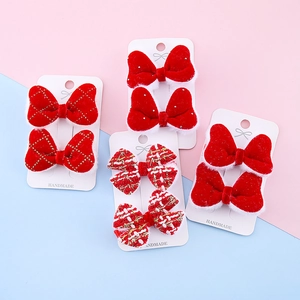 Set handgefertigter roter Neujahrs-Haarspangen mit Samt- und Tweed-Schleifen