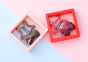Détails du set de barrettes à cheveux nœud et étoile dans des boîtes cadeaux transparentes