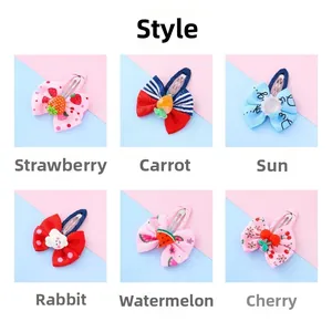 Detail of six colorful cartoon hair clips featuring strawberry, rabbit, and cloud shapes