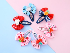 Close-up of 6-piece children's hair clips set with cartoon resin fruits and cute animals