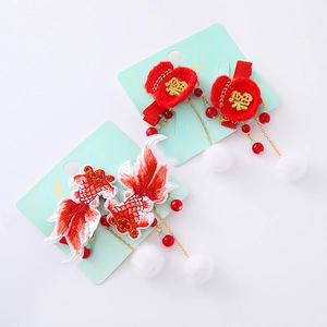 Traditional Chinese New Year hair clips with embroidered koi fish and lucky red pouches