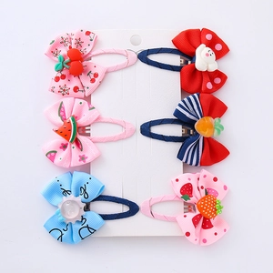 6-pack of cute kids' bow hair clips with resin cartoons on a white display card