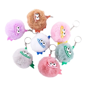 Set of seven colorful monster faux rabbit fur plush keychains with cartoon eyes and rings